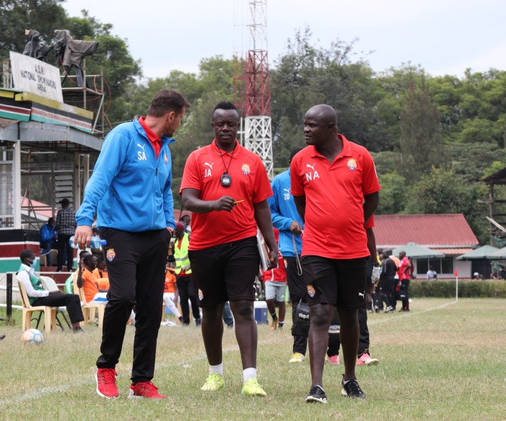 John Amboko is sandwiched by former coach Sanjin Alagic whom he took over from in mid-July 2021. To the right is assistant coach Noah Abich