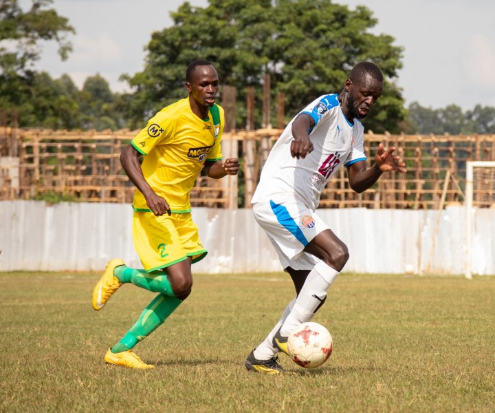 Homeboyz fullback three Eric Ambunya tracks City Stars midfielder Peter Opiyo (no. 10) during an away game to Kakamega Homeboyz in Bukhungu on Thur 20 Jan 2022. The game ended 4-4