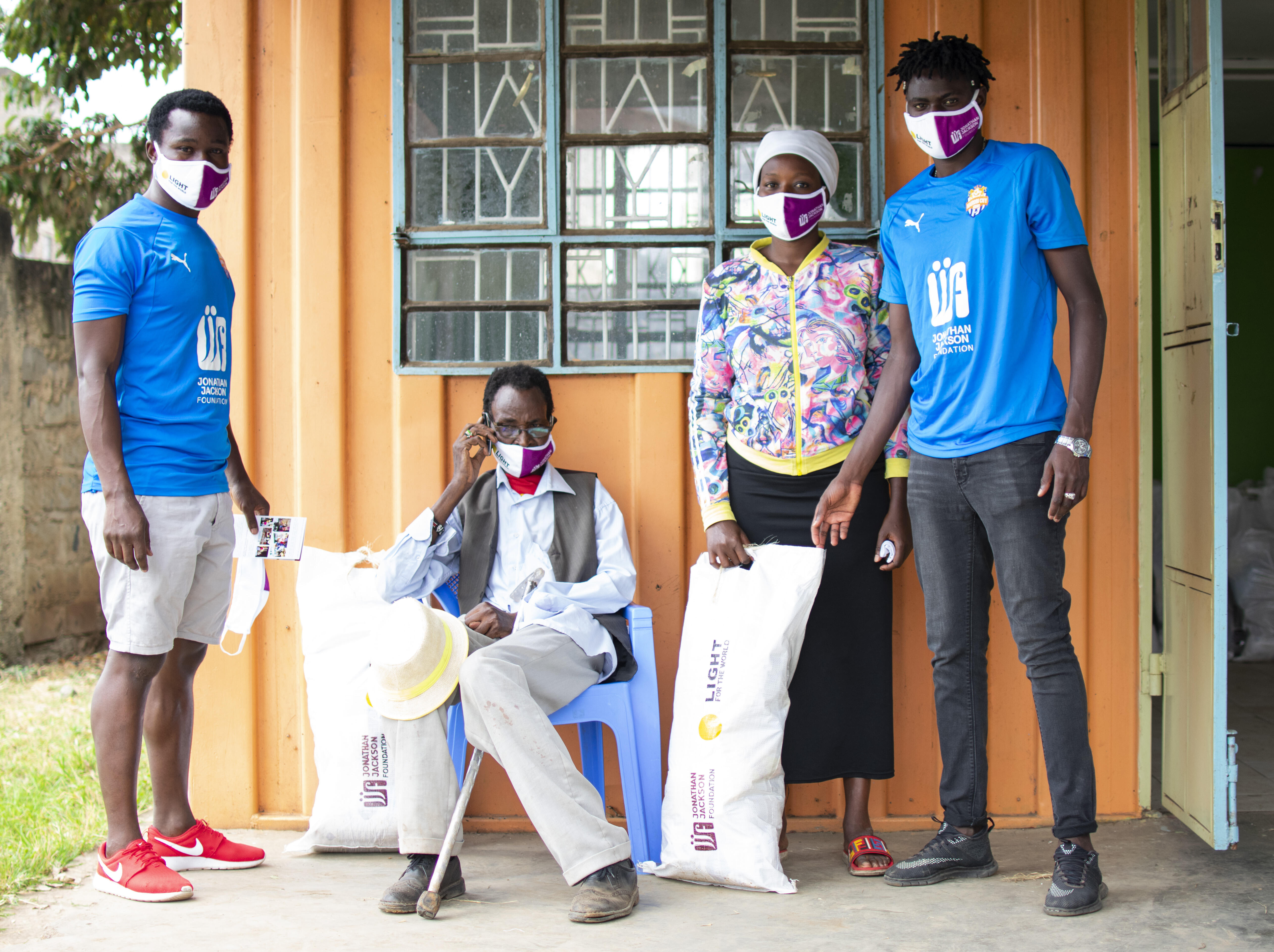 Calvin Masawa and Vincent Otieno of City Stars distributing food stuff provided by Light for the World at Dandora 44 on Tue 9 June 2020