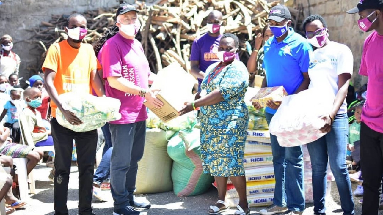 City Stars Chair Jonathan Jackson and CEO Patrick Korir together with members of Kubamba Krew and Shibisha Initiative handing food to the Director of Rehoboth Blessed Assurance Children's Home in Mwiki, Kasarani on Sat 11 July 2020