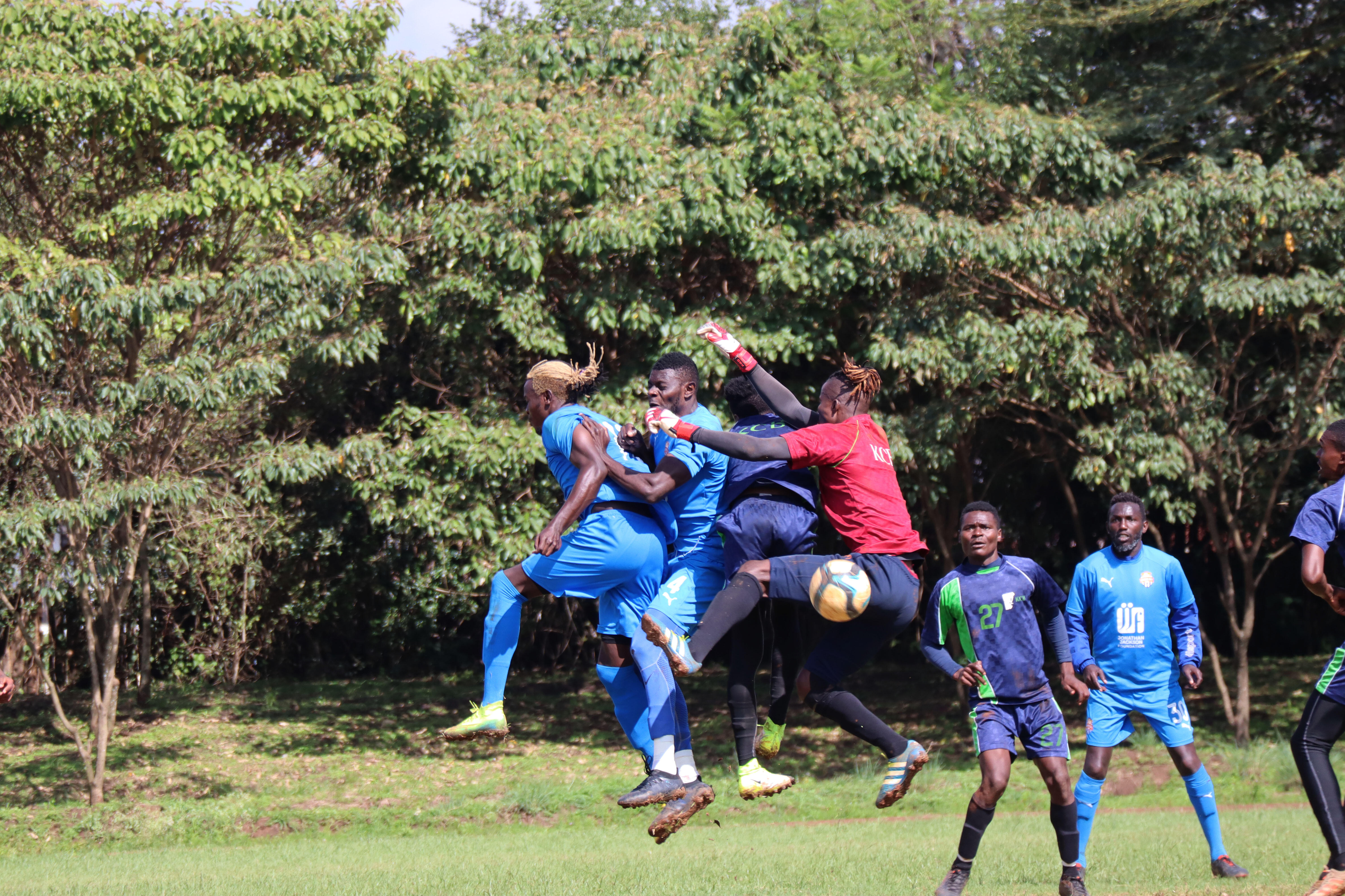 KCB keeper Gabriel Andika goes for the ball against Davis Agesa and Salim Abdallah during a friendly at Public Service Club on Wed 11 Nov 2020. KCB won 1-0