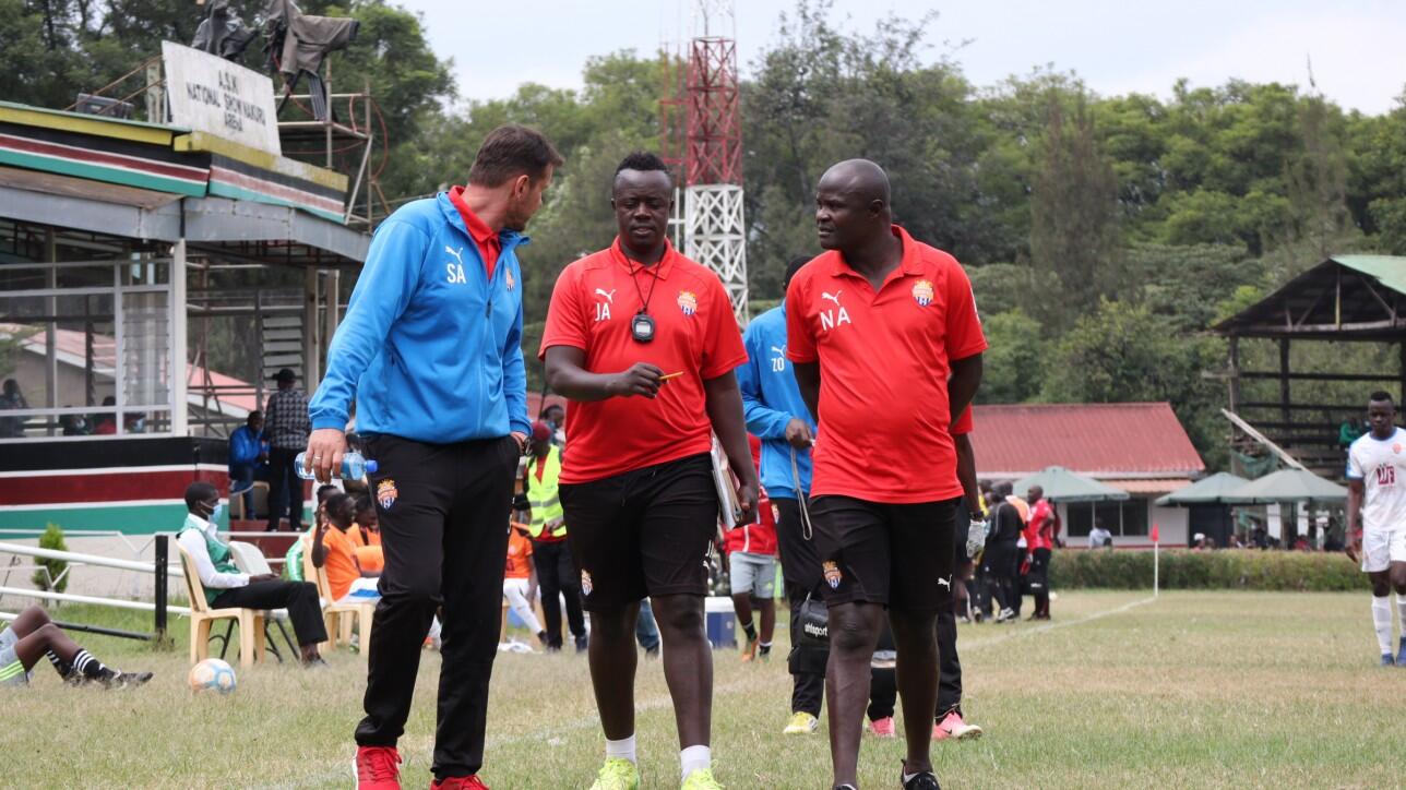 John Amboko is sandwiched by former coach Sanjin Alagic whom he took over from in mid-July 2021. To the right is assistant coach Noah Abich