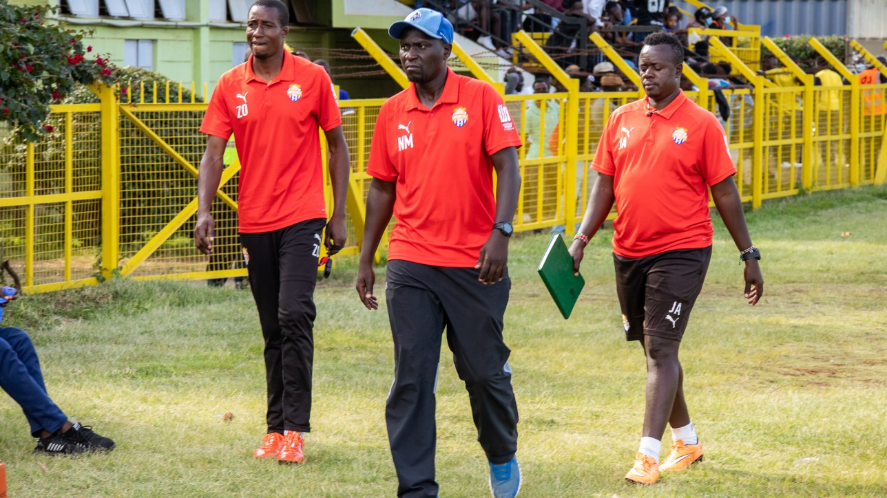 Nicholas Muyoti flanked by keeper trainer Zachary Onyango, and assistant coach John Amboko